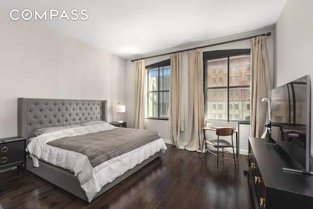 250 W St Unit 3F, New York City, NY 10013 - bedroom with dark wood-style floors and baseboards