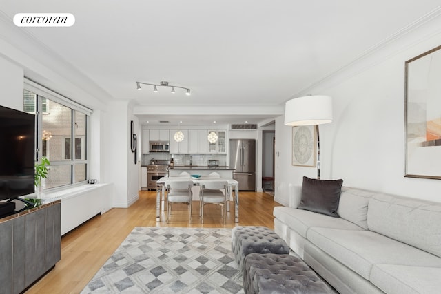 200 E 66th St Unit E306, New York City, NY 10065 - living area featuring light wood-type flooring and crown molding