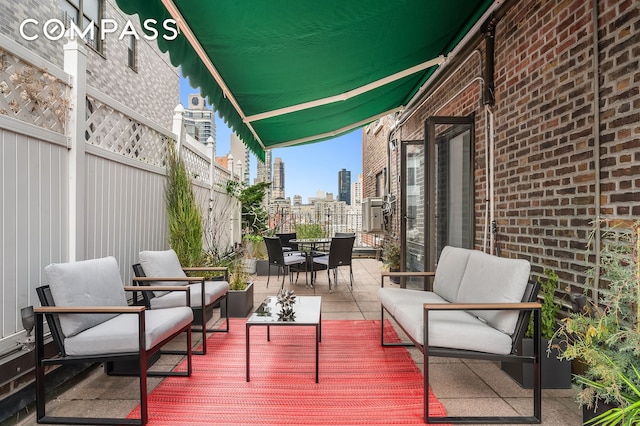 227 E 57th St Unit 18Bf, New York City, NY 10022 - wooden deck with outdoor dining area, a view of city, an outdoor living space, and a patio