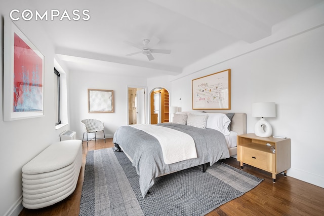 227 E 57th St Unit 18Bf, New York City, NY 10022 - bedroom featuring wood finished floors, arched walkways, and a ceiling fan