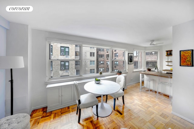 dining area featuring ceiling fan, baseboards, and visible vents