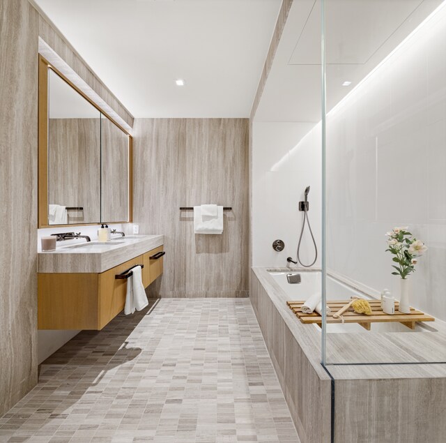 77 Greenwich St Unit 33C, New York City, NY 10006 - full bath featuring a tile shower, vanity, and tile walls