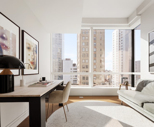 77 Greenwich St Unit 33C, New York City, NY 10006 - home office featuring a view of city, wood finished floors, and a wealth of natural light