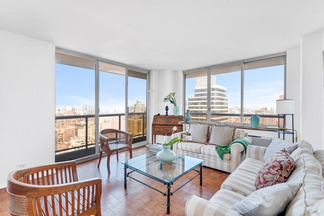 200 E 89th St Unit 30B, New York City, NY 10128 - living area featuring a wall of windows and a city view