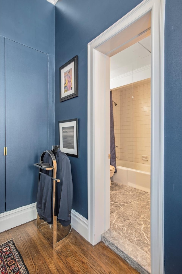 17 E 80th St Unit 6/3R, New York City, NY 10075 - full bath with baseboards, toilet, wood finished floors, and shower / bath combination