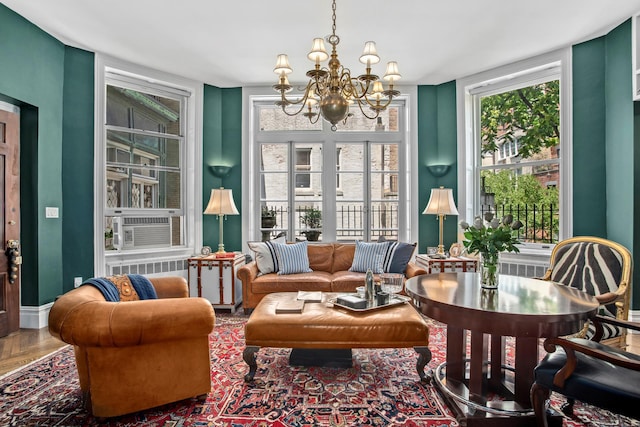 17 E 80th St Unit 6/3R, New York City, NY 10075 - living area with a chandelier, wood finished floors, and cooling unit