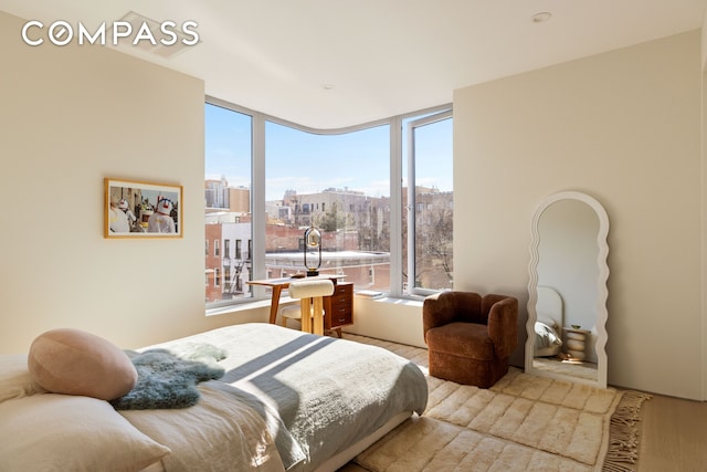 276 Berry St, New York City, NY 11249 - bedroom with a city view and wood finished floors