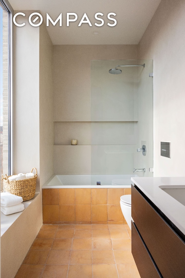 276 Berry St, New York City, NY 11249 - bathroom featuring toilet, tiled shower / bath, tile patterned floors, and vanity