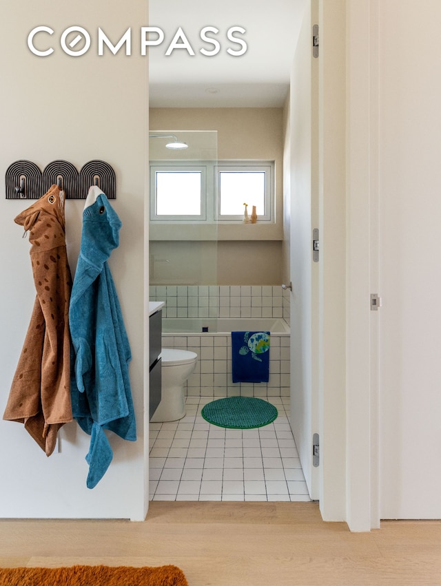 276 Berry St, New York City, NY 11249 - full bathroom with a tub to relax in, tile patterned floors, and toilet
