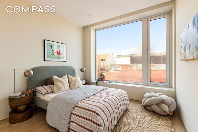 276 Berry St, New York City, NY 11249 - bedroom featuring wood finished floors