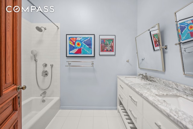 bathroom featuring double vanity, washtub / shower combination, baseboards, and a sink