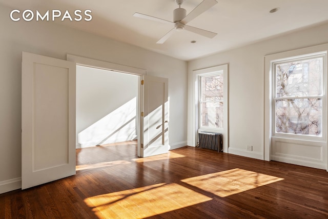 125 W 15th St, New York City, NY 10011 - empty room with radiator, wood finished floors, and a ceiling fan