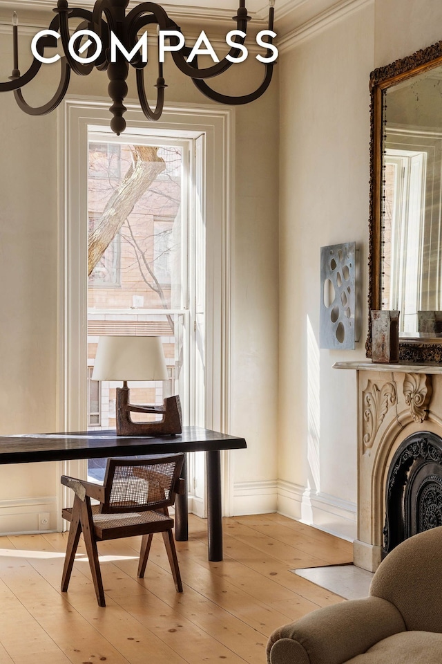 125 W 15th St, New York City, NY 10011 - sitting room featuring a chandelier, crown molding, baseboards, and wood finished floors