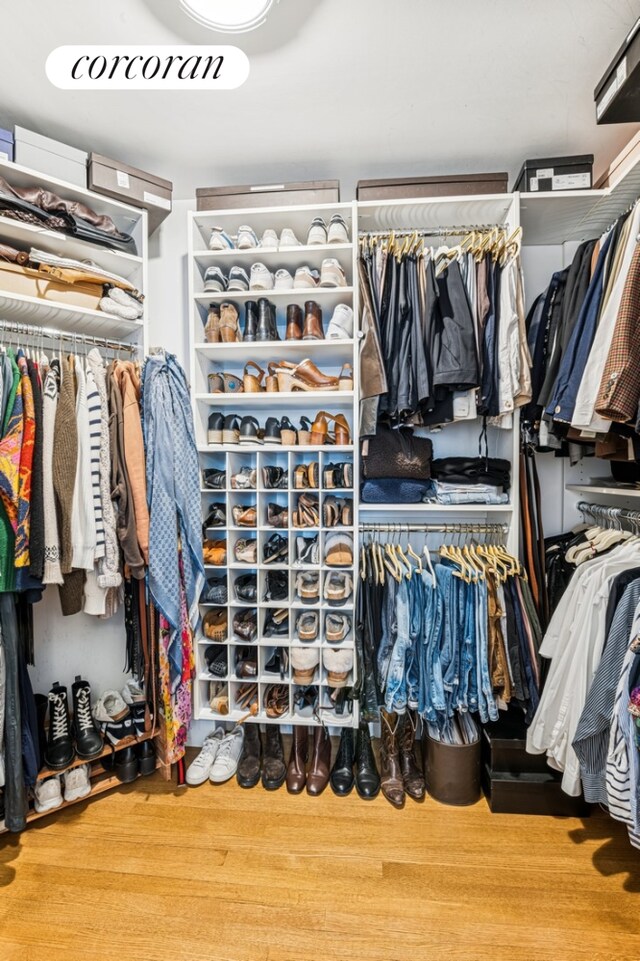 27 W 72nd St Unit 1615, New York City, NY 10023 - walk in closet featuring wood finished floors