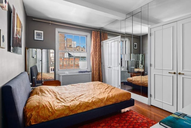 108 E 66th St Unit 9A, New York City, NY 10065 - bedroom featuring wood finished floors and beam ceiling