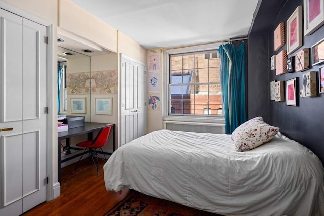 108 E 66th St Unit 9A, New York City, NY 10065 - bedroom with wood finished floors and a desk