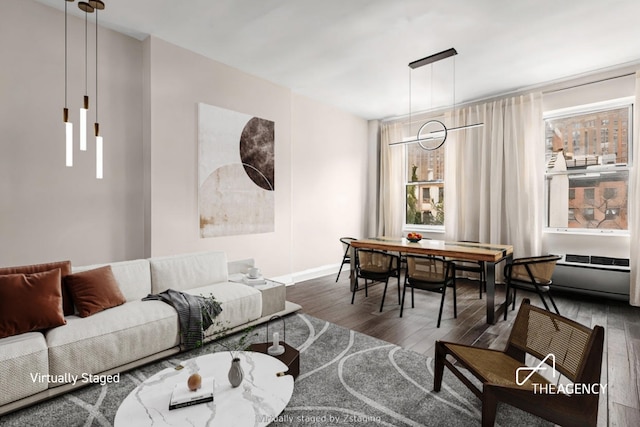411 W 21st St Unit 3Flr, New York City, NY 10011 - living room featuring wood finished floors and baseboards