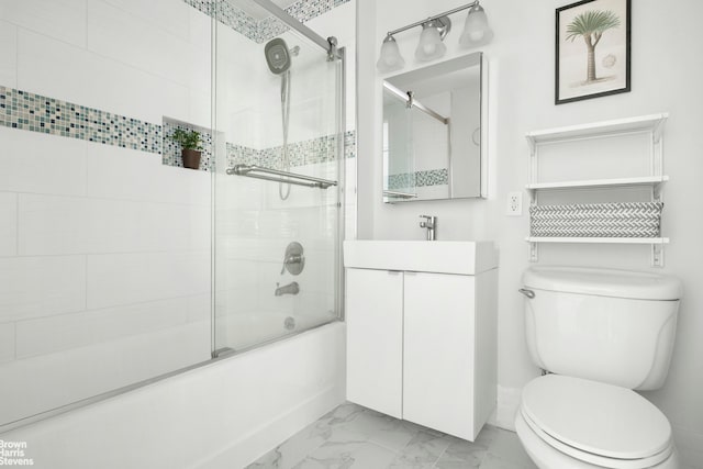 bathroom featuring marble finish floors, toilet, combined bath / shower with glass door, and vanity