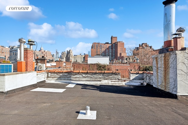 view of asphalt road with a view of skyline and street lighting