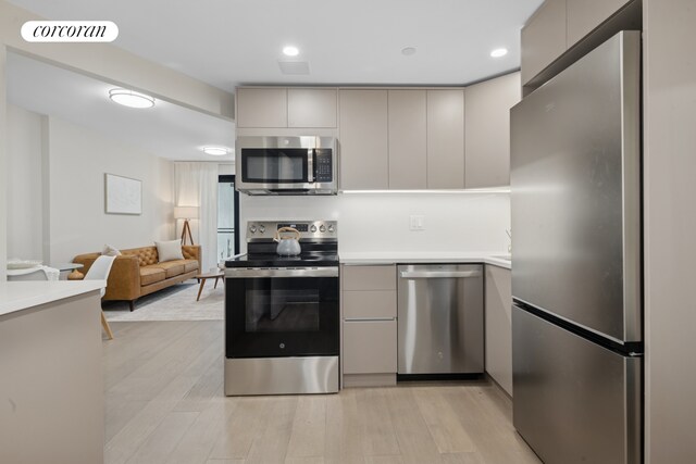 608 Ocean Ave Unit 403, New York City, NY 11226 - kitchen featuring stainless steel appliances, modern cabinets, gray cabinetry, and light countertops