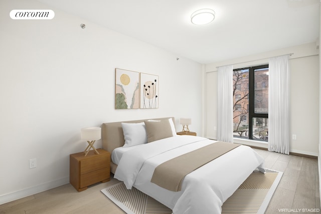 608 Ocean Ave Unit 403, New York City, NY 11226 - bedroom featuring light wood-style floors and baseboards