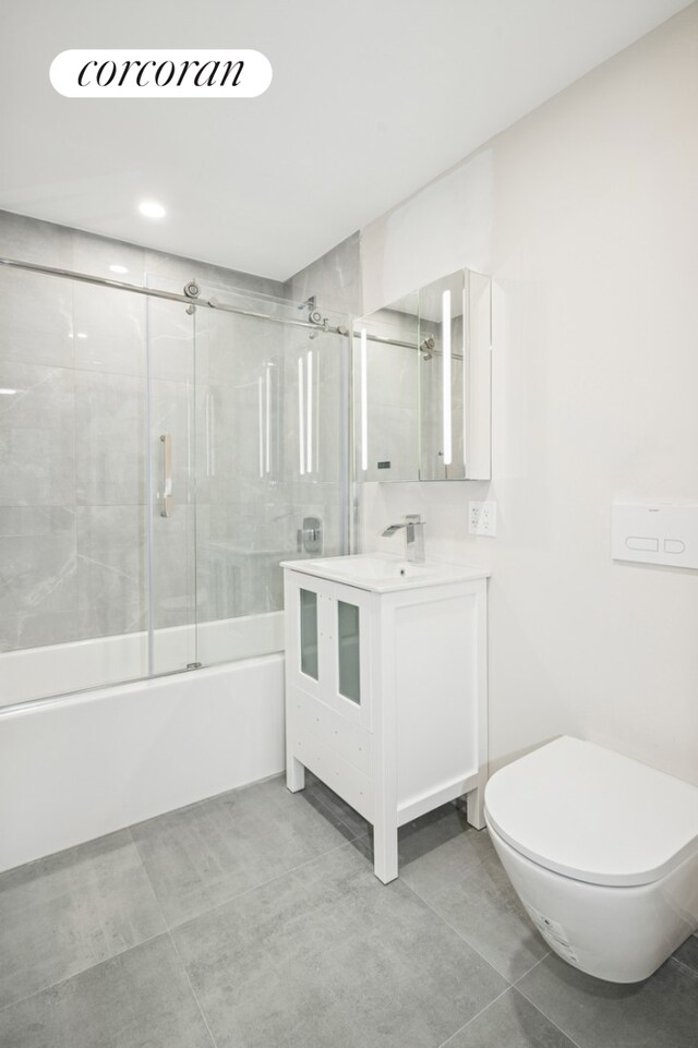 608 Ocean Ave Unit 403, New York City, NY 11226 - full bath with toilet, vanity, and bath / shower combo with glass door