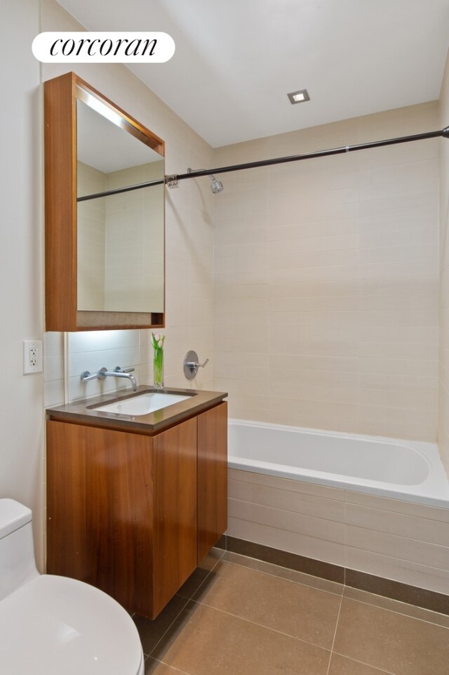 555 W 59th St Unit 18G, New York City, NY 10019 - full bathroom with toilet, washtub / shower combination, tile patterned flooring, and vanity