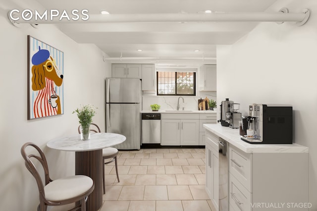 184 Clinton Ave Unit Garden1, New York City, NY 11205 - kitchen with stainless steel appliances, light countertops, tasteful backsplash, recessed lighting, and light tile patterned floors