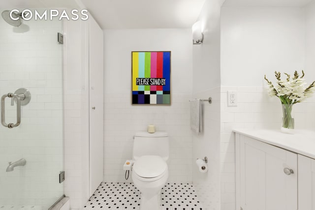 184 Clinton Ave Unit Garden1, New York City, NY 11205 - full bath with tile walls, a shower stall, wainscoting, and vanity