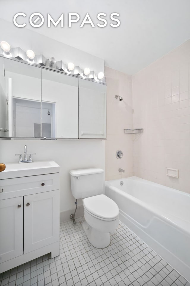full bath with toilet, tile patterned floors, washtub / shower combination, and vanity