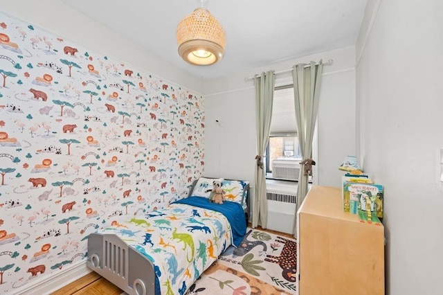 bedroom featuring radiator heating unit