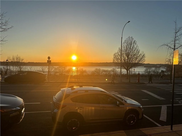 view of parking at dusk