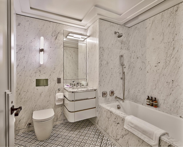 bathroom with tile walls, a combined bath / shower with marble appearance, toilet, tile patterned floors, and vanity