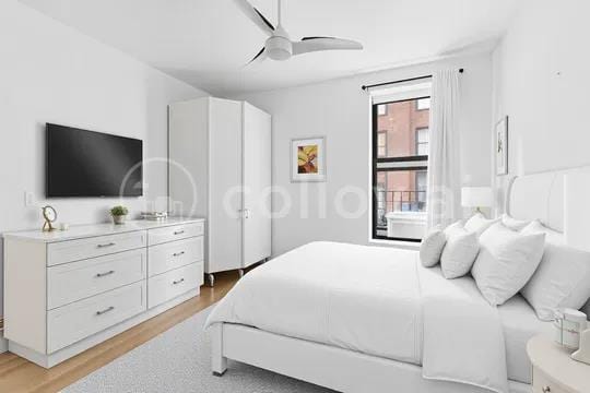 14 Prince St Unit 2-F, New York City, NY 10012 - bedroom with light wood-style floors and ceiling fan