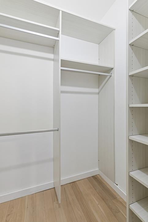 14 Prince St Unit 2-F, New York City, NY 10012 - walk in closet featuring wood finished floors