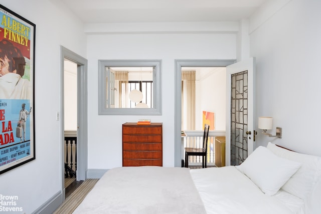 1 W 67th St Unit 309, New York City, NY 10023 - bedroom with multiple windows and wood finished floors