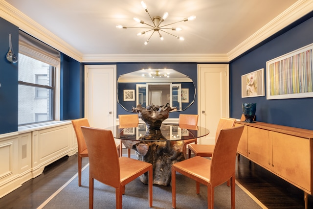 220 E 73rd St Unit 6Cde, New York City, NY 10021 - dining space featuring ornamental molding, dark wood finished floors, a wainscoted wall, and a notable chandelier