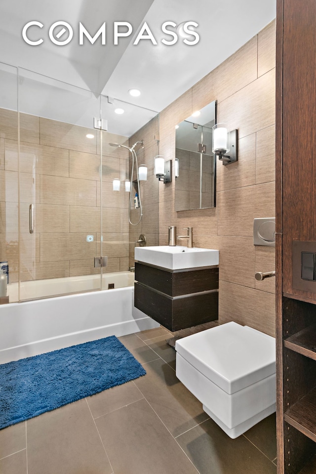 240 W 23rd St Phc, Phc, New York City, NY 10011 - full bathroom with bath / shower combo with glass door, tile patterned flooring, and vanity