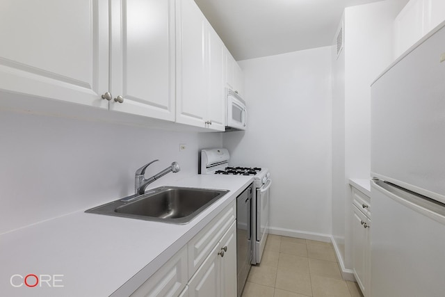 160 W End Ave Unit 28L, New York City, NY 10023 - kitchen featuring white appliances, a sink, white cabinetry, and light countertops