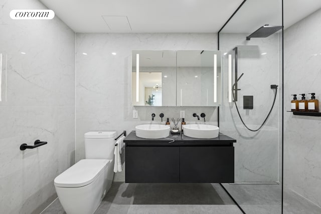 350 W 44th St Unit 704, New York City, NY 10036 - full bath featuring double vanity, a marble finish shower, and toilet
