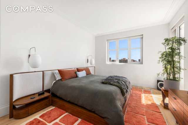 250 E 21st St Unit 10A, New York City, NY 10010 - bedroom with crown molding and wood finished floors