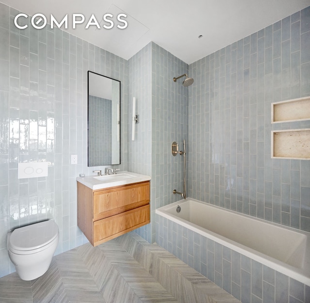 250 E 21st St Unit 10A, New York City, NY 10010 - full bath featuring tile walls, tiled shower / bath combo, toilet, and vanity