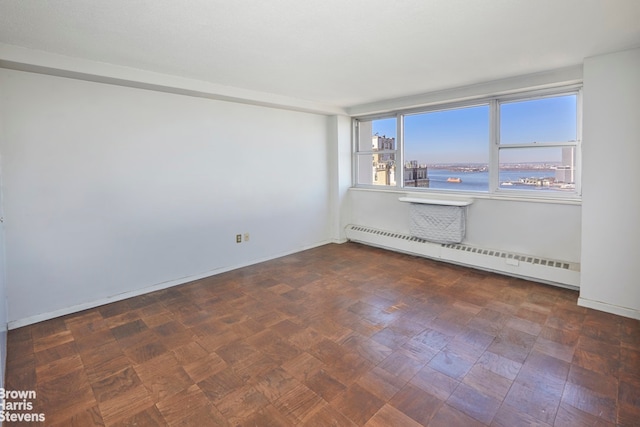 75 Henry St Unit 30K, New York City, NY 11201 - unfurnished room with baseboard heating, a water view, and baseboards