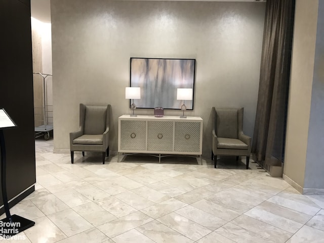 75 Henry St Unit 30K, New York City, NY 11201 - sitting room featuring marble look tiles and baseboards