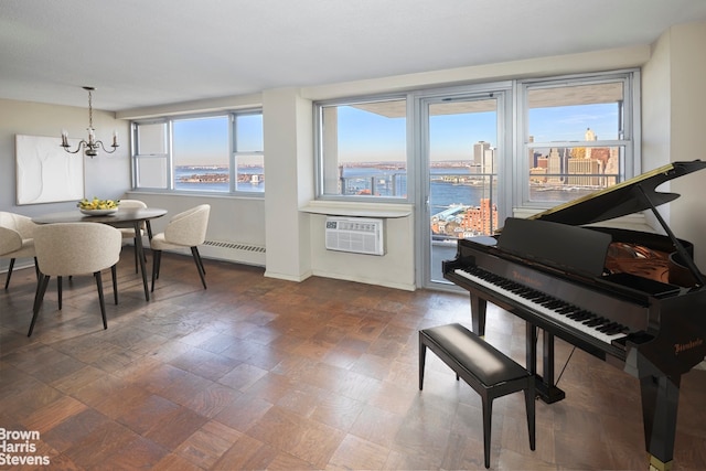 75 Henry St Unit 30K, New York City, NY 11201 - dining room featuring an AC wall unit, a baseboard heating unit, a chandelier, and baseboards