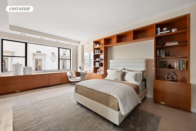 bedroom featuring visible vents and light wood-type flooring