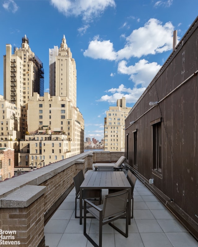 view of patio / terrace featuring a city view