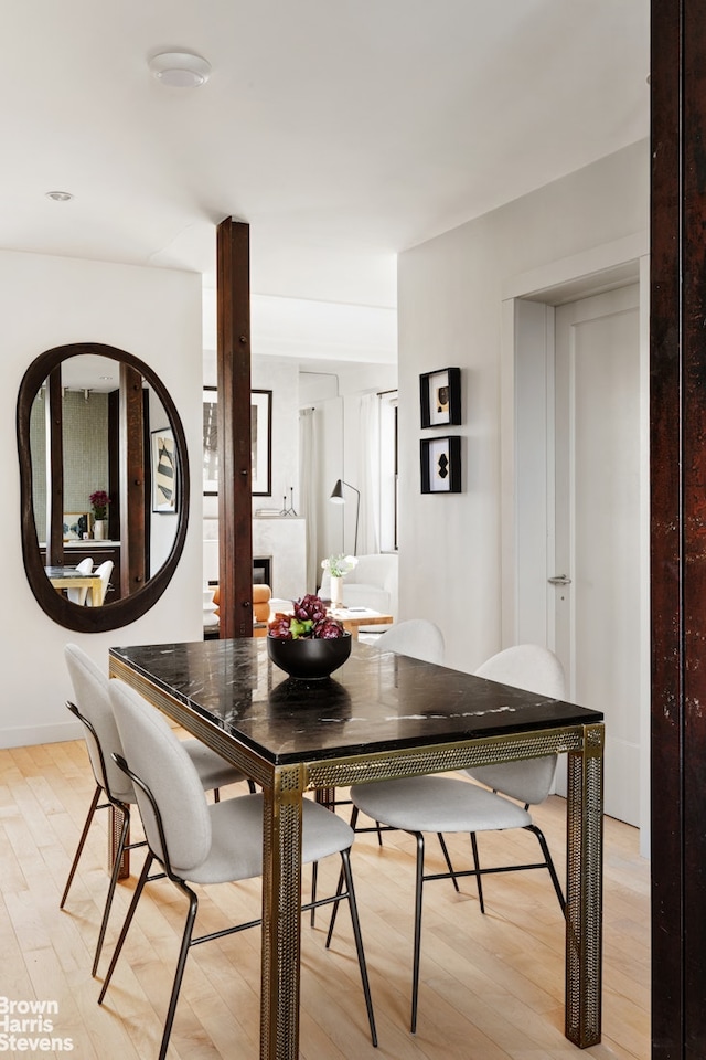 dining space featuring light wood-type flooring