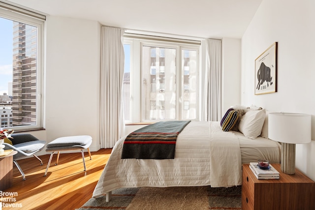 15 William St Unit 33I, New York City, NY 10004 - bedroom featuring wood finished floors