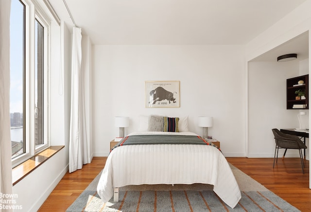15 William St Unit 33I, New York City, NY 10004 - bedroom with wood finished floors and baseboards